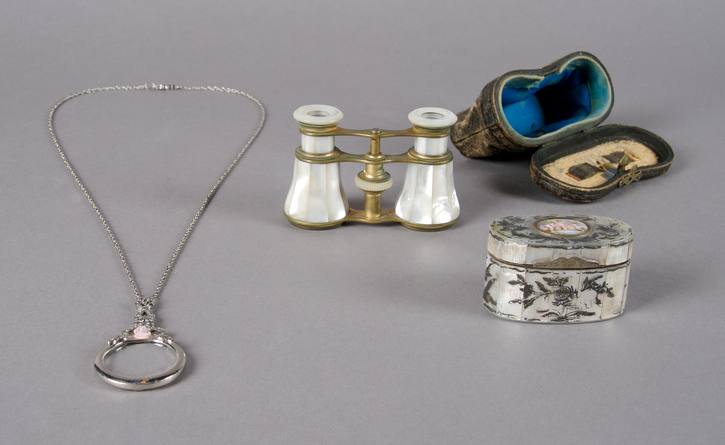 A Pair of French Mother-of-Pearl Opera Glasses, Height of first approximately 2 1/2 inches.
