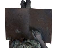 A Bronze Figure of a Young Girl Reading a Book — 20TH CENTURY