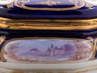 A Sèvres Style Painted and Parcel Gilt Porcelain Table Casket