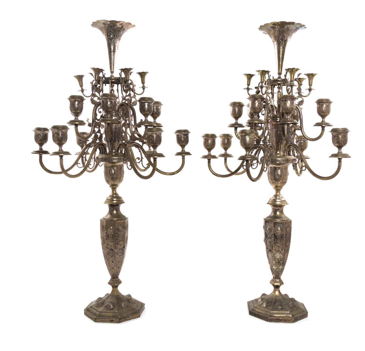 A Pair of Persian Silver Eighteen-Light Candelabra, Iran, Probably Mid-20th Century, each topped with a trumpet vase centering foliate