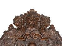 An Italian Renaissance Revival Carved Walnut Savonarola Chair