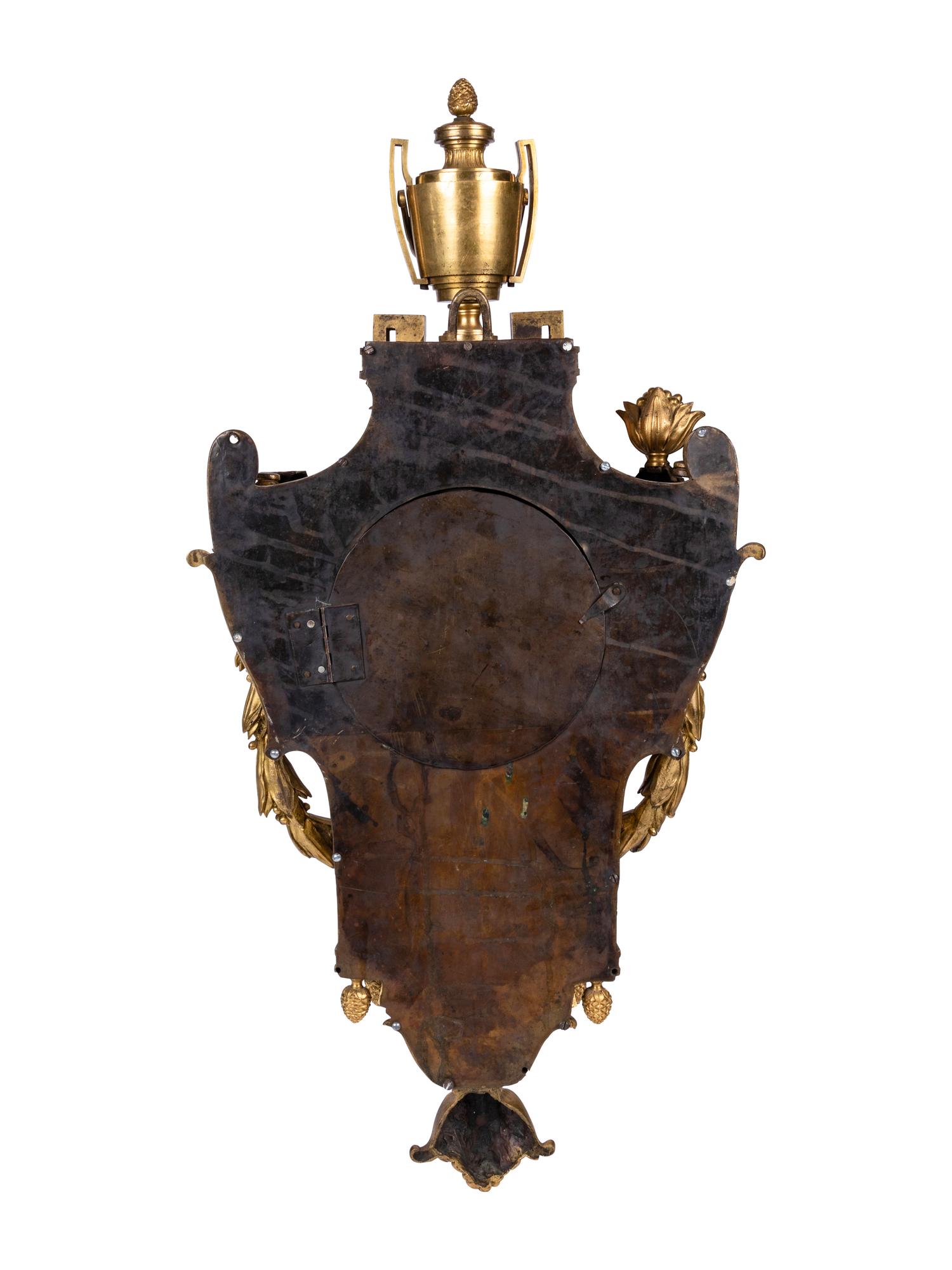 A Louis XVI Gilt Bronze Cartel Clock