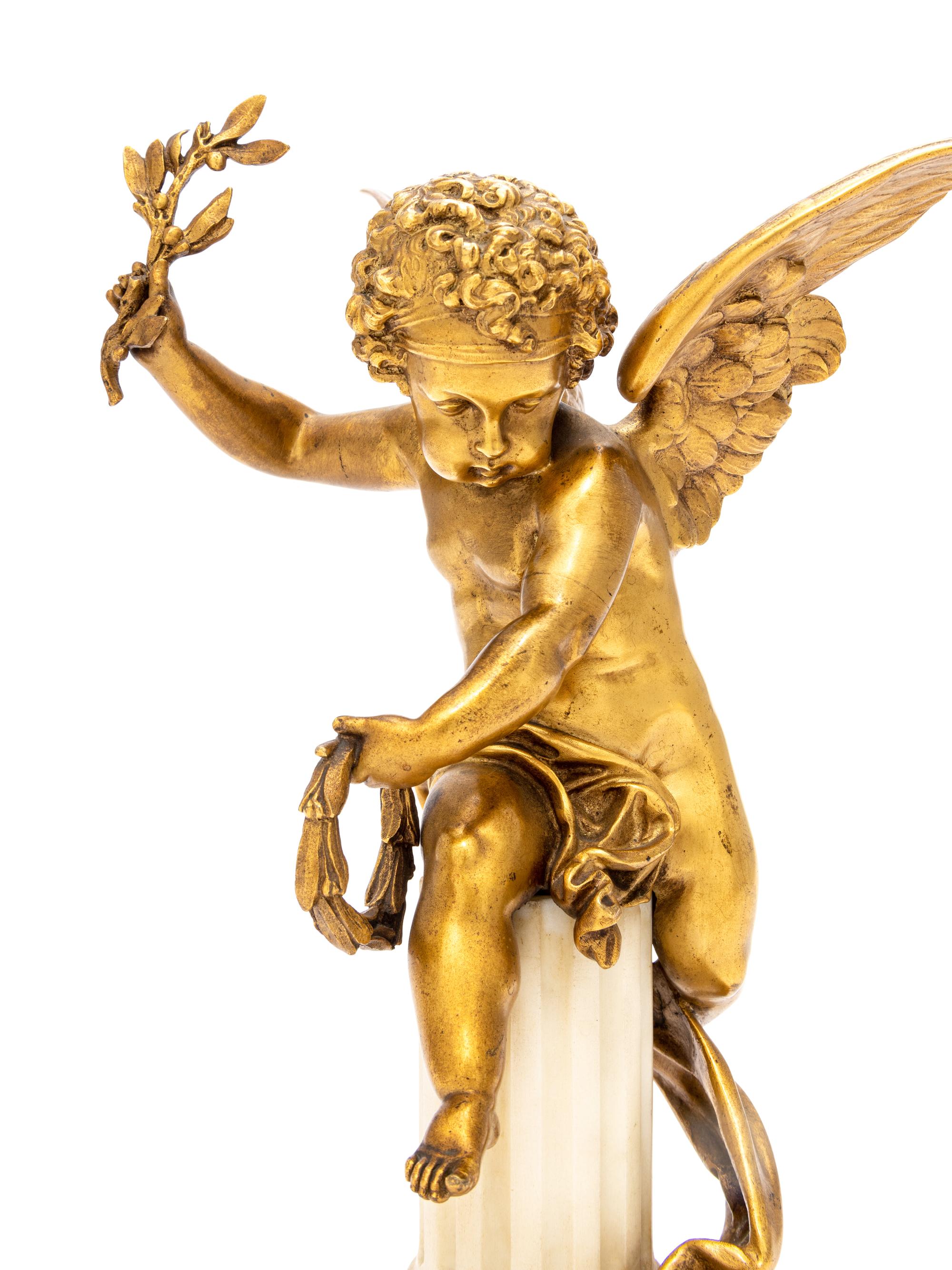A Gilt Bronze and Marble Putto Ornament