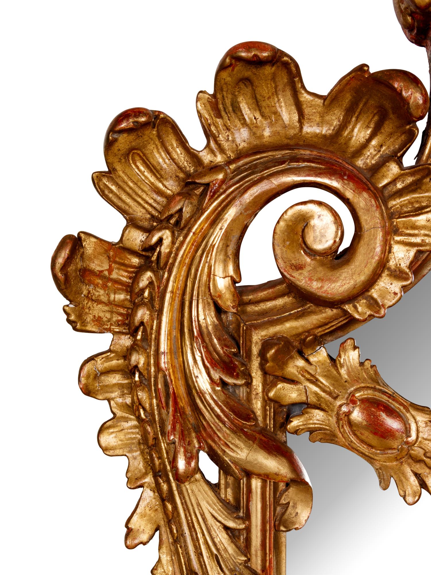 A Régence Style Giltwood and Composition Mirror