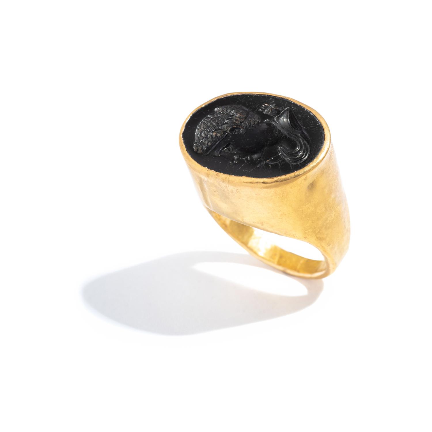 A Roman Gold and Onyx Finger Ring with a Portrait Head of the Goddess Diana