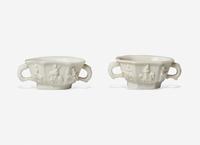 Two Similar Chinese Dehua Porcelain Twin Handled Cups