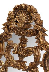 A Pair of Italian Giltwood Oval Mirrors