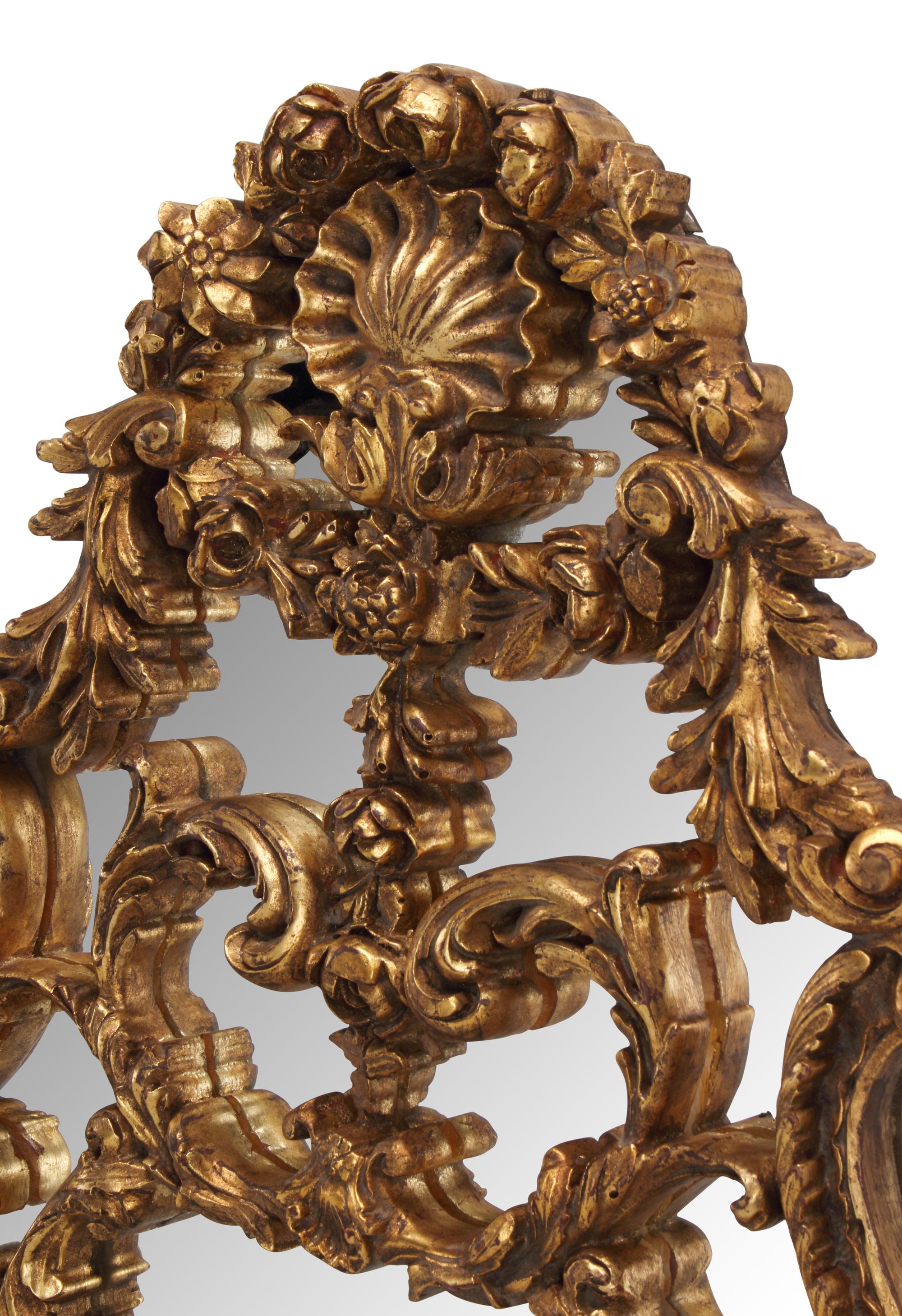 A Pair of Italian Giltwood Oval Mirrors