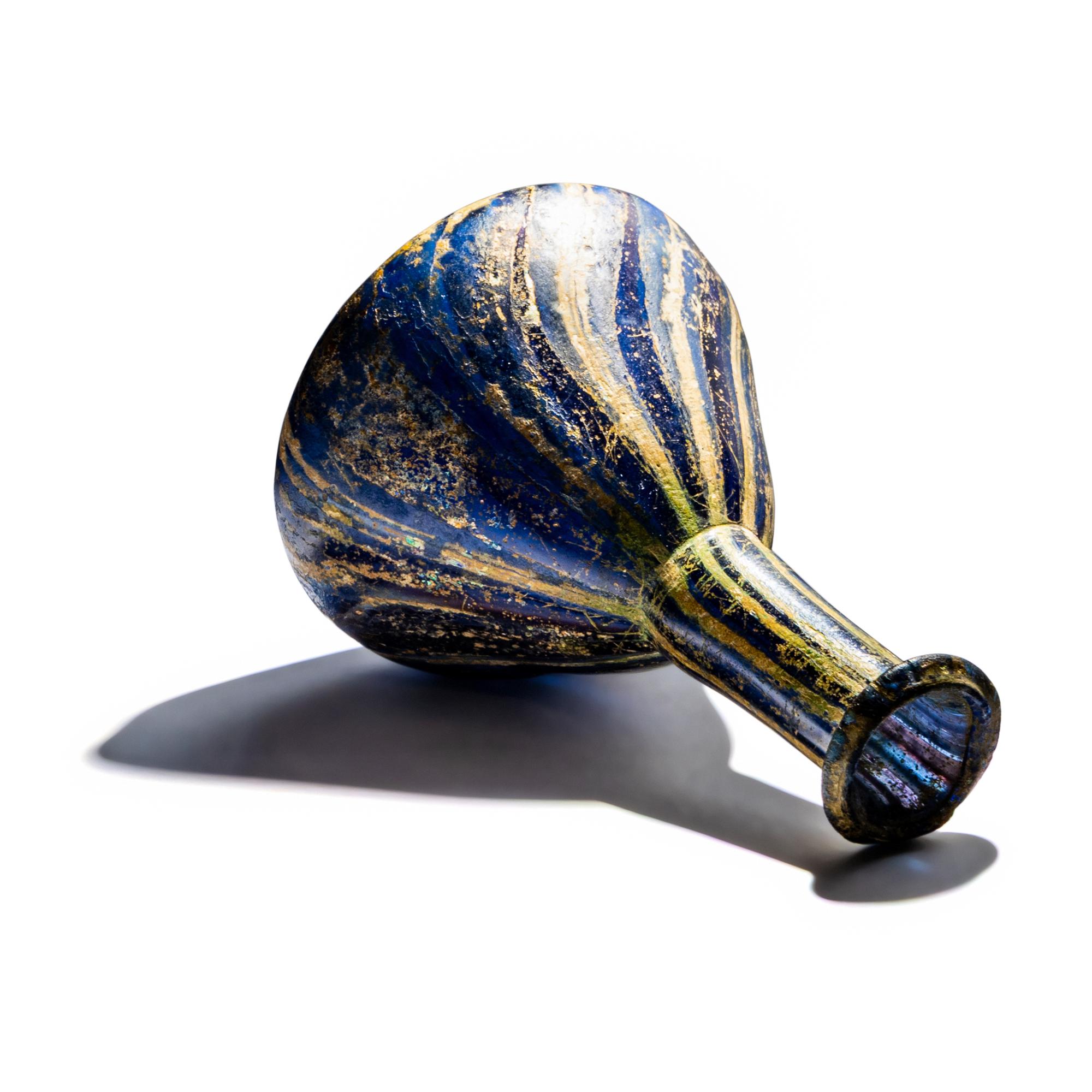 A Roman Marbled Glass Unguentarium