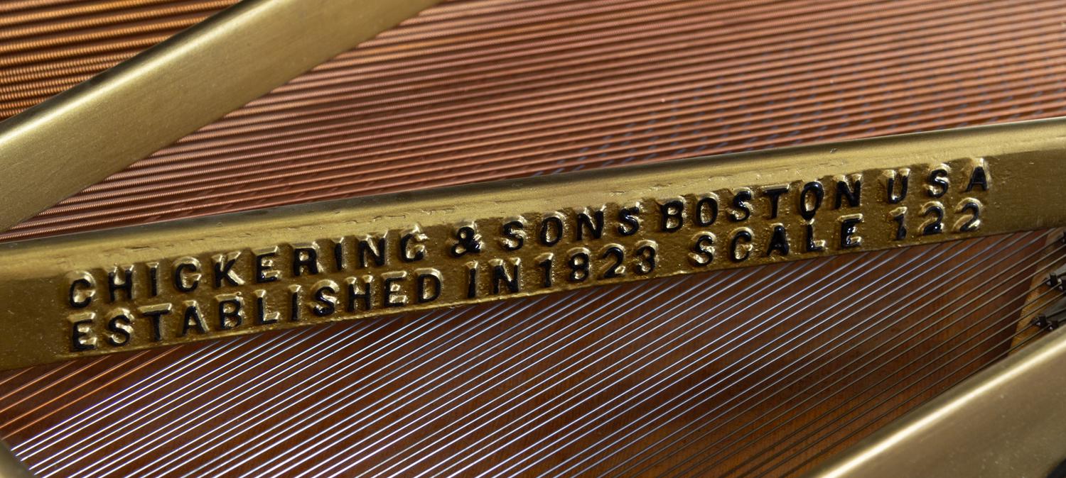 A Chickering & Sons Baby Grand Piano