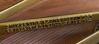 A Chickering & Sons Baby Grand Piano
