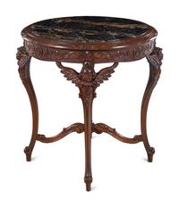 An Italian Carved Walnut Marble-Top Center Table