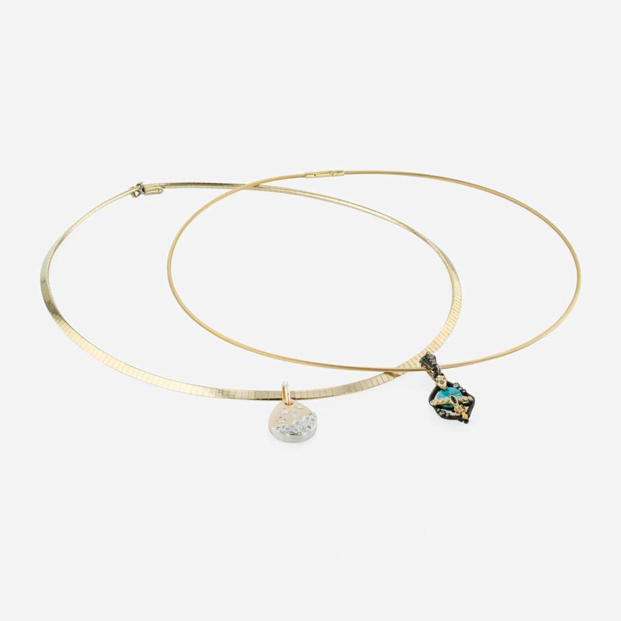 A Set of Two Yellow Gold Omega Necklaces and Charms
