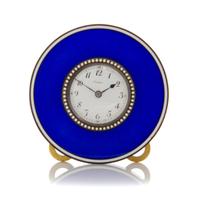 A Jeweled and Guilloche Enameled Table Clock, Cartier, 20th century, of circular form, the enameled dial with Arabic numeral hours and