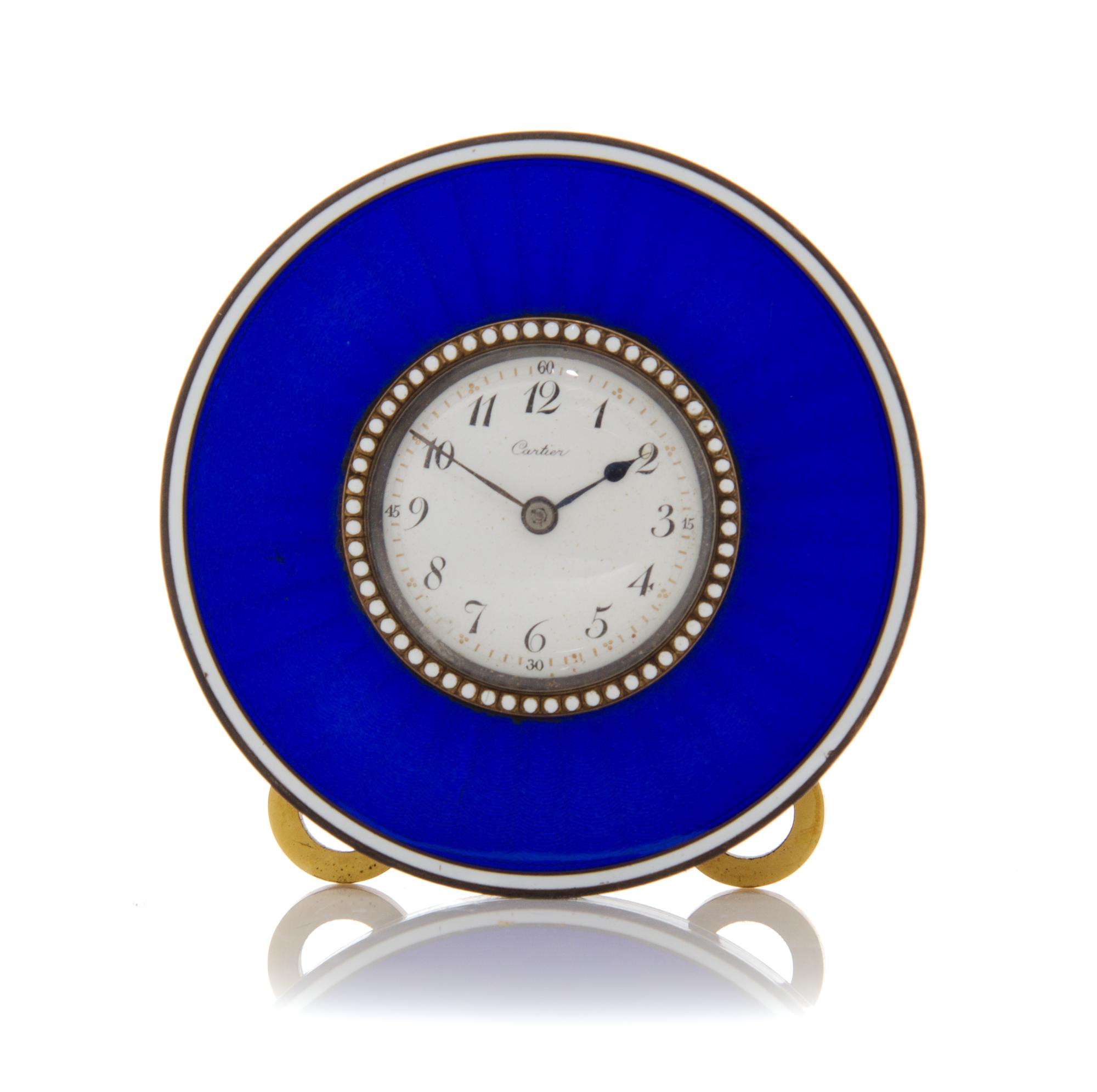 A Jeweled and Guilloche Enameled Table Clock, Cartier, 20th century, of circular form, the enameled dial with Arabic numeral hours and