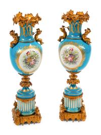 A Pair of Sèvres Style Gilt Bronze Mounted Porcelain Urns