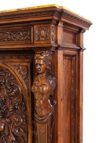 A Pair of Renaissance Revival Carved Walnut Marble-Top Cabinets
