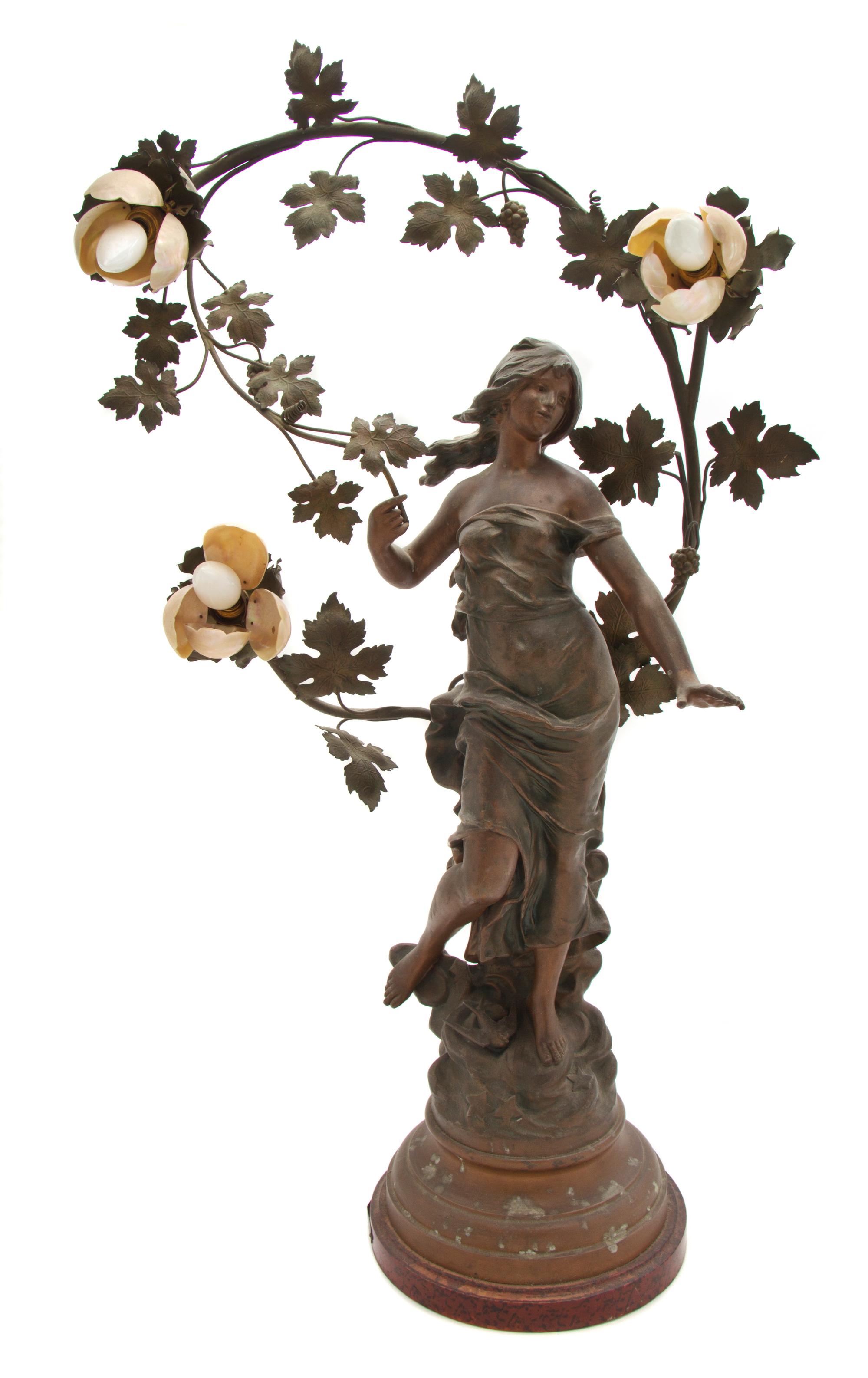 An Art Nouveau Cast Metal Three-Light Figural Newel Lamp, after Auguste Moreau, Height 35 1/2 inches.
