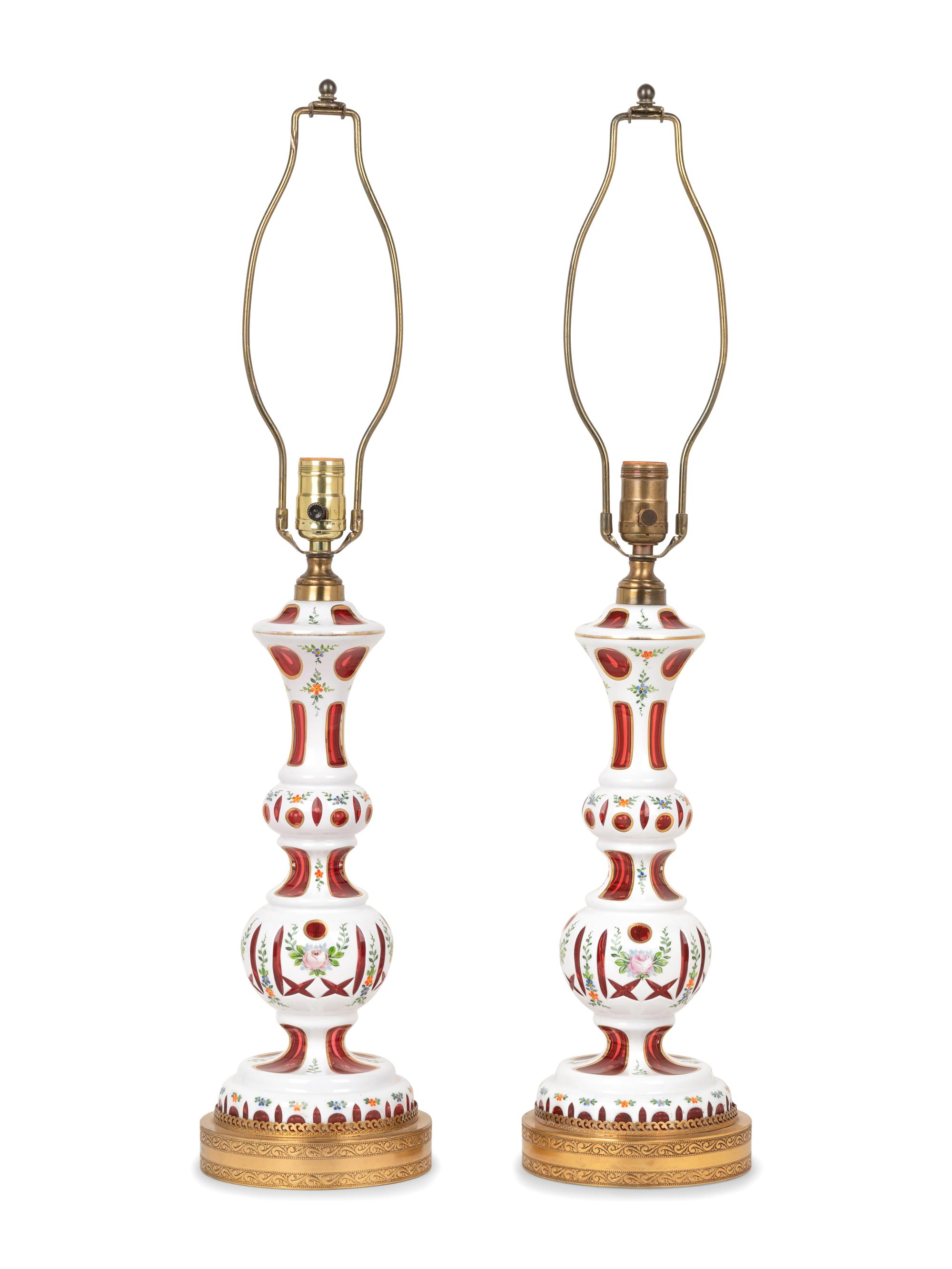 A Pair of Bohemian Enameled White Overlay Ruby Glass Lamps