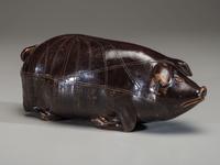 An Anna Pottery Incised and Brown Glazed Pig Flask