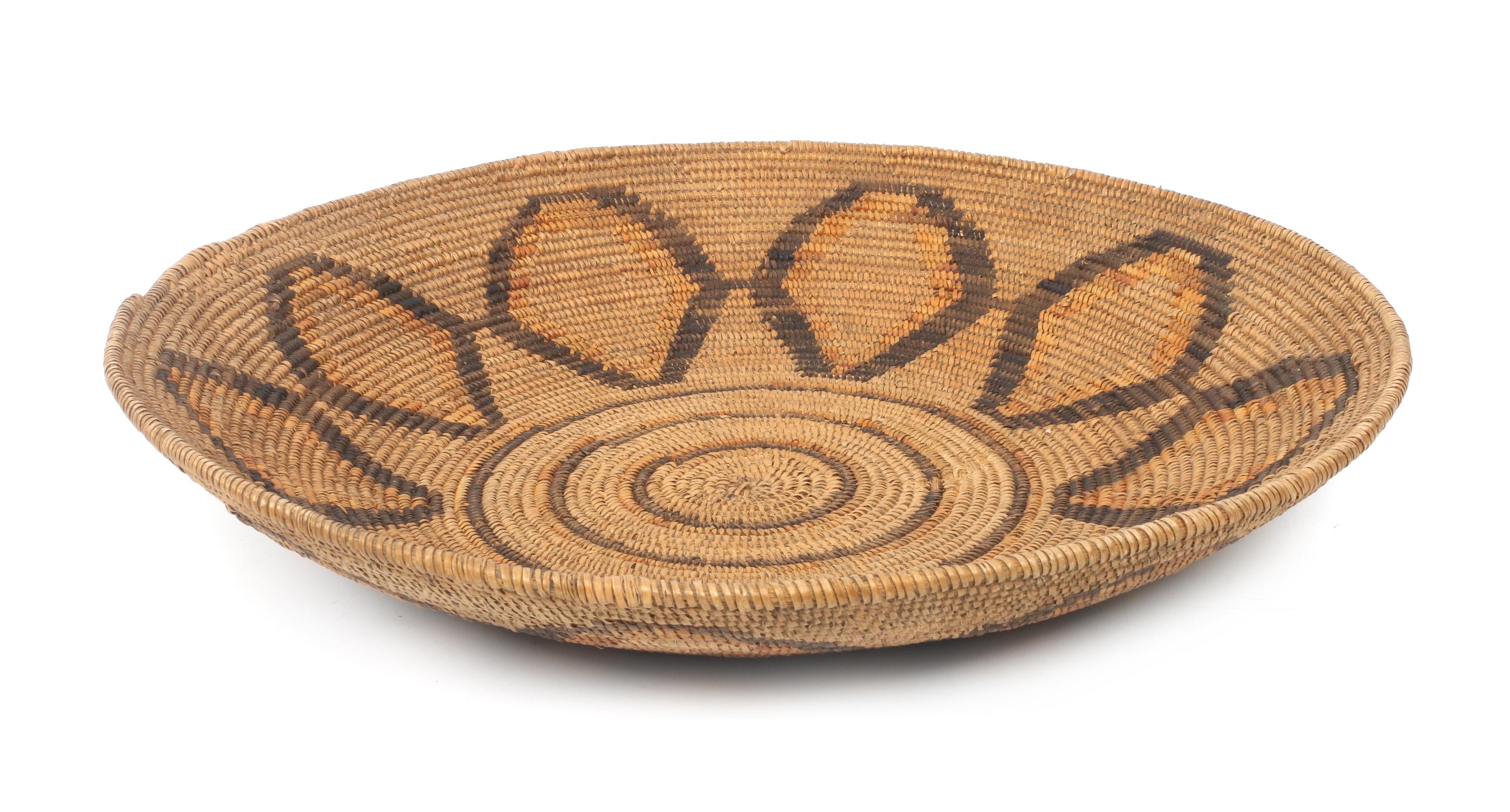 A Mission Indian Basket Tray Height 2 7/8 x diameter 16 7/8 inches.