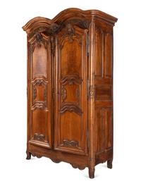 A Louis XV Carved Walnut Armoire