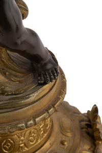 A Pair of French Gilt and Patinated Bronze Six-Light Candelabra
