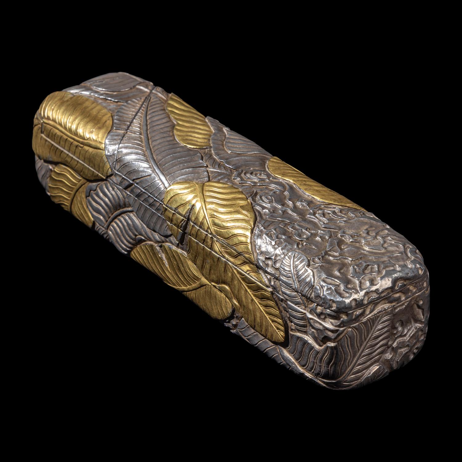 A Chinese Parcel-Gilt Silver Repoussé 'Plantain Leaves' Rectangular Scroll Box, Incised Qianlong Mark 清乾隆乙卯（1796）銀鎏金鏨蕉葉紋手卷機關盒