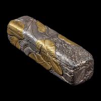 A Chinese Parcel-Gilt Silver Repoussé 'Plantain Leaves' Rectangular Scroll Box, Incised Qianlong Mark 清乾隆乙卯（1796）銀鎏金鏨蕉葉紋手卷機關盒