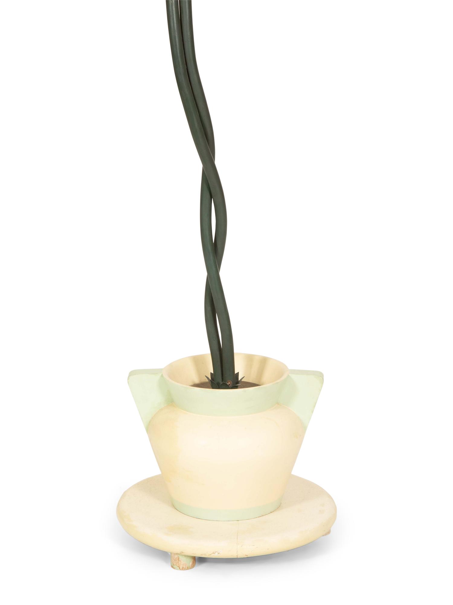A Green-Painted Metal Lamp Modeled as a Tropical Plant