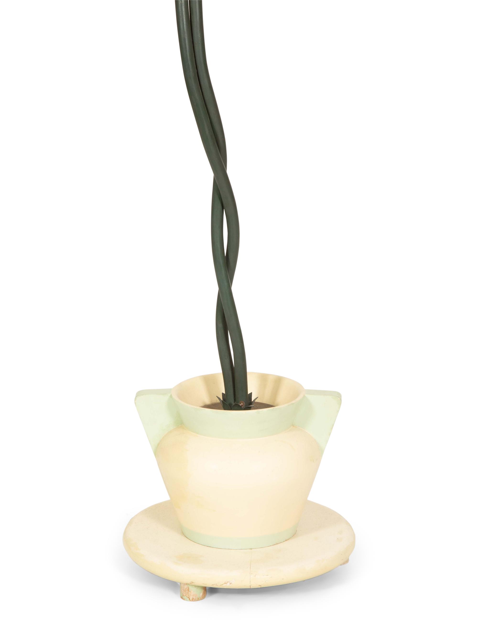 A Green-Painted Metal Lamp Modeled as a Tropical Plant