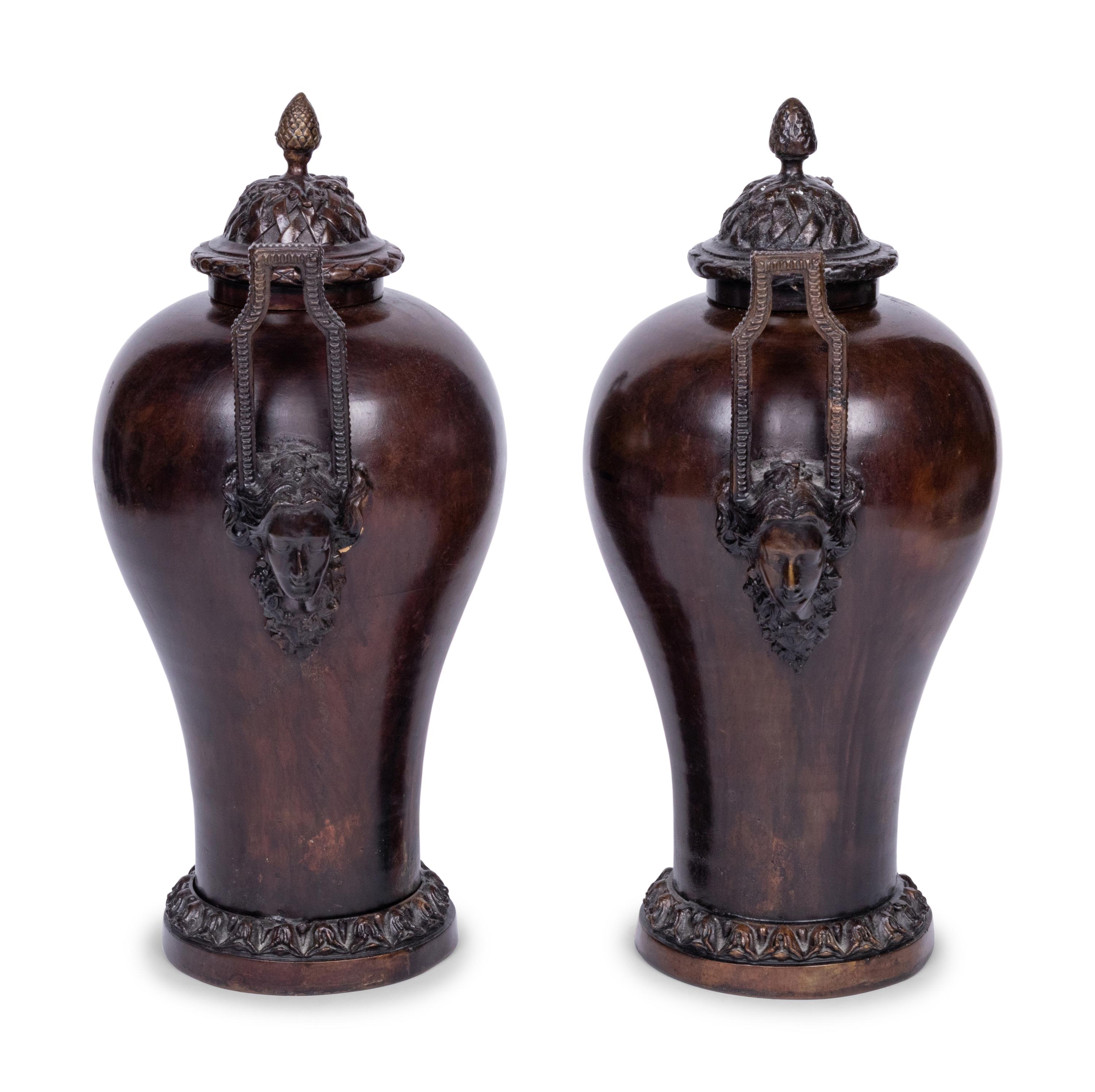 A Pair of Neoclassical Style Patinated Bronze Covered Urns
