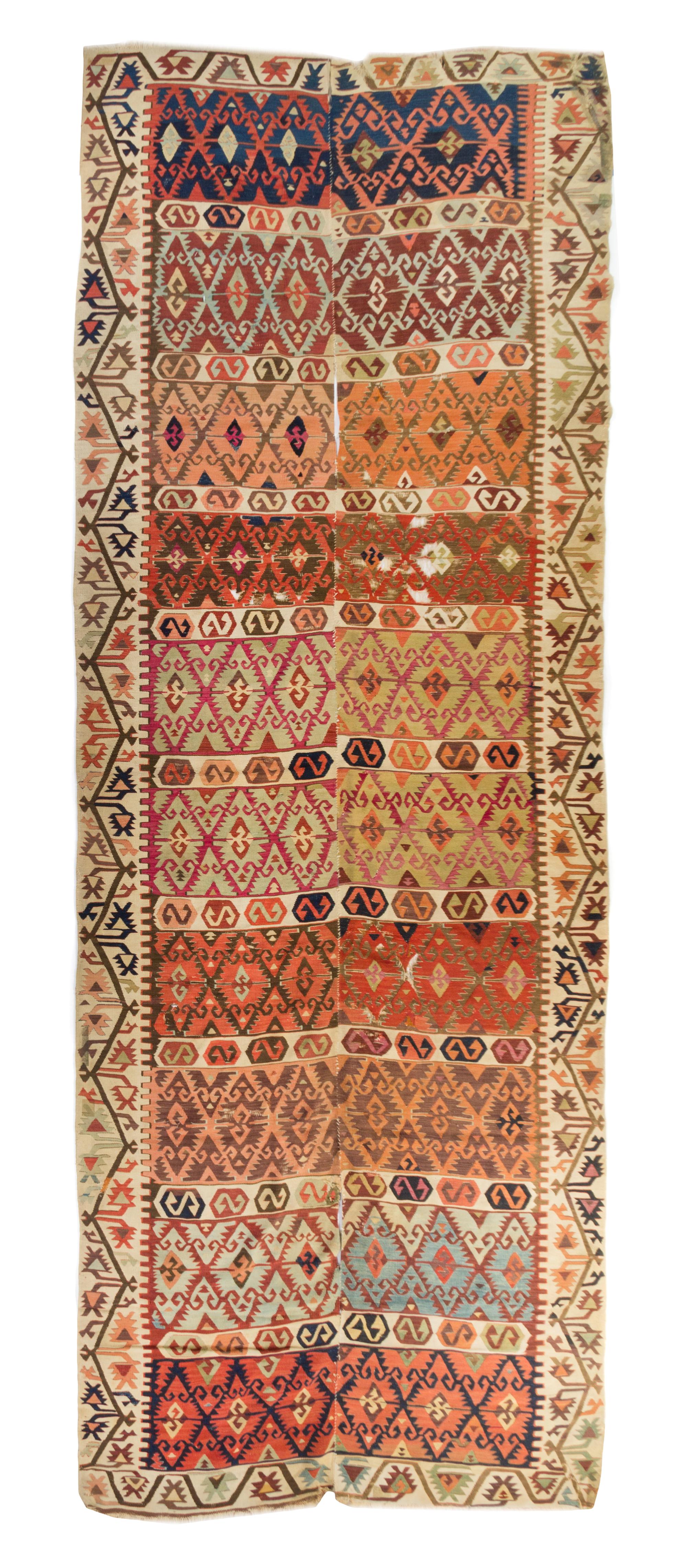 A Kilim Wool Rug 10 feet 3 inches x 4 feet 7 1/2 inches.