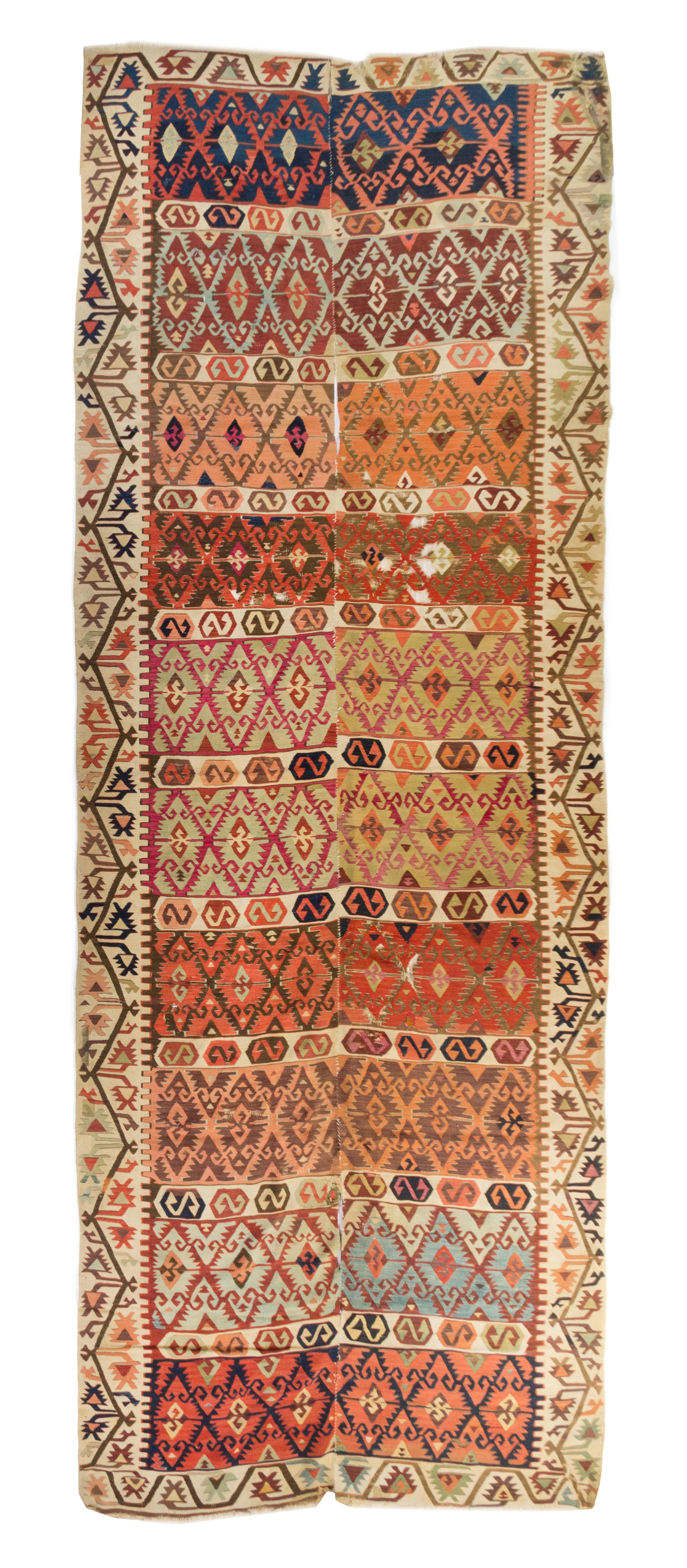 A Kilim Wool Rug 10 feet 3 inches x 4 feet 7 1/2 inches.