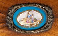 A Louis XV Style Chiffonier with Porcelain Inset Plaques