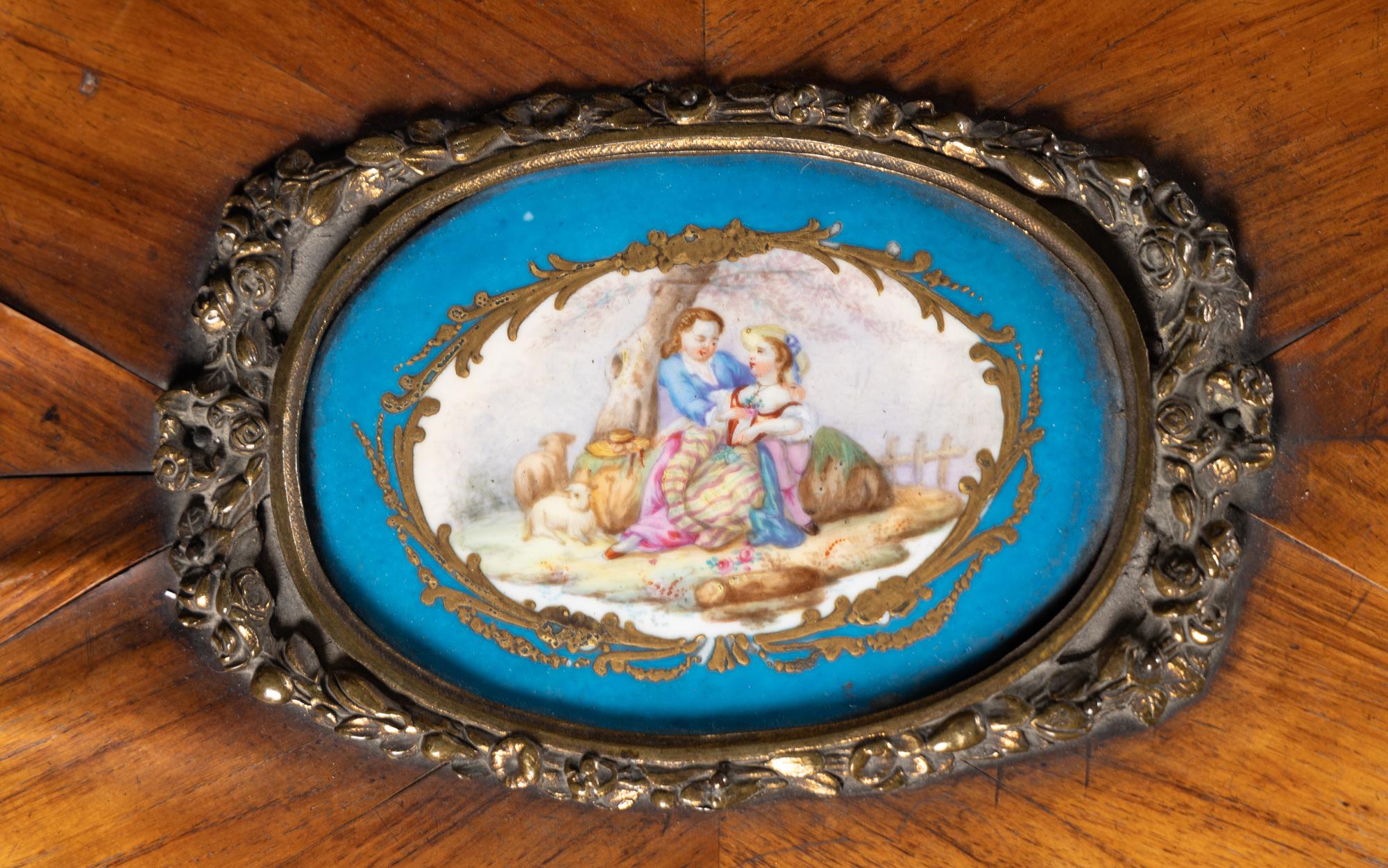 A Louis XV Style Chiffonier with Porcelain Inset Plaques