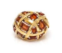 An 18 Karat Yellow Gold, Platinum and Garnet "Dome Of Ribbons" Ring, Schlumberger for Tiffany & Co., 9.90 dwts.
