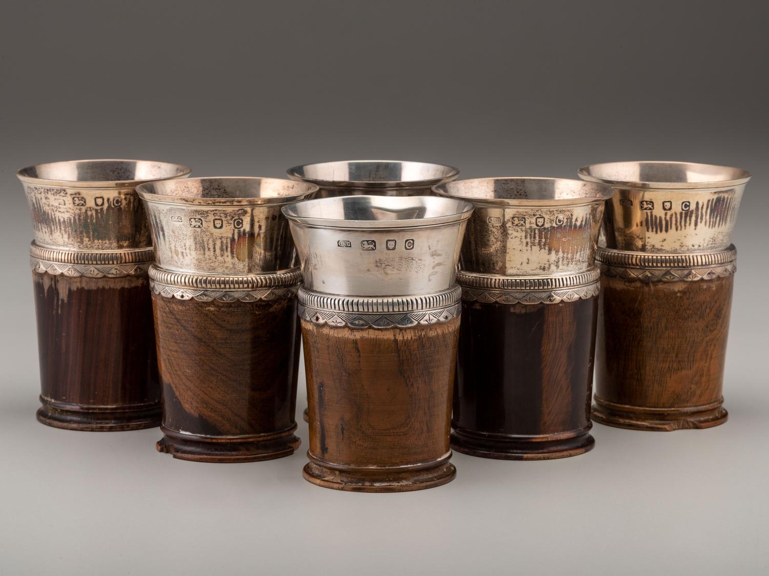 A Silver Mounted Mahogany Pitcher and Six Cups