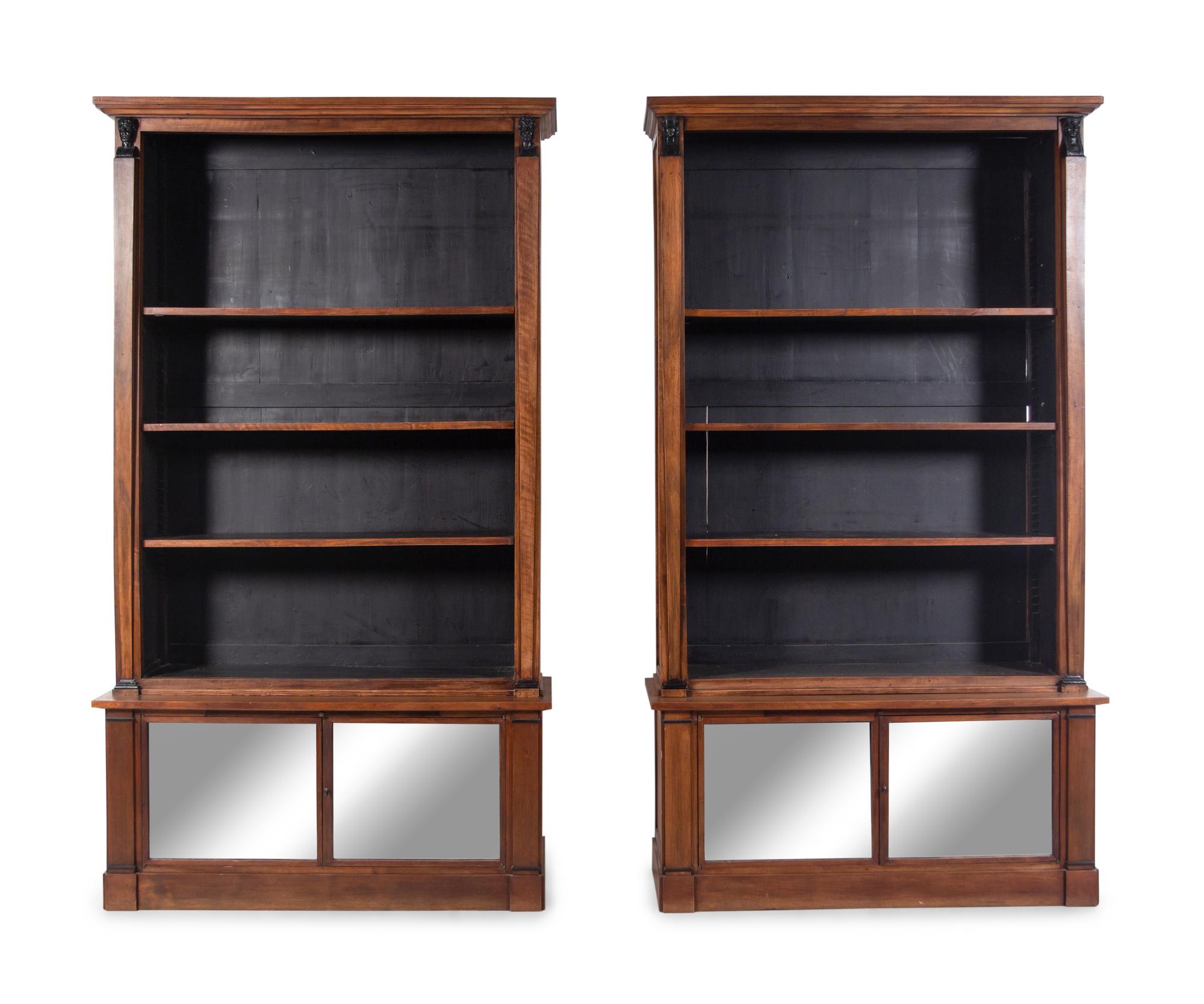 A Pair of Italian Parcel Ebonized Walnut Bookcases