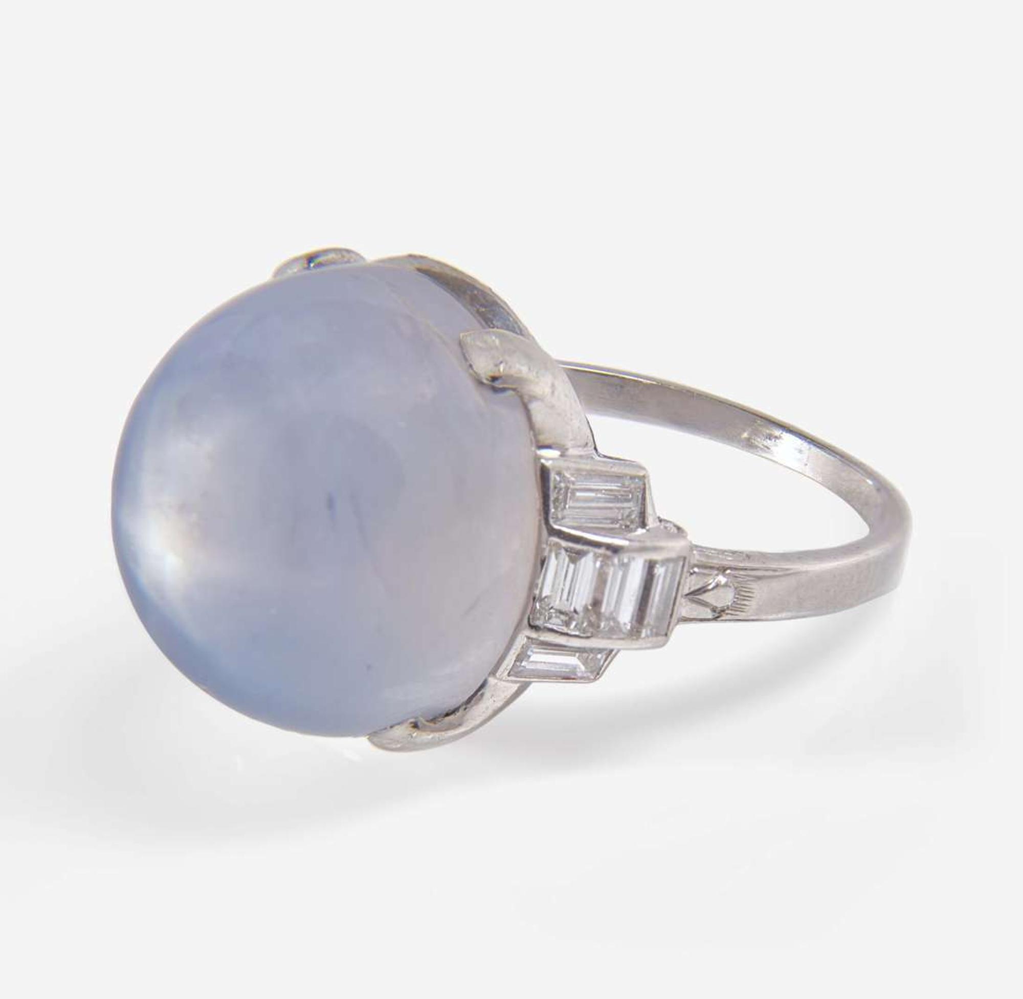 A Platinum, Diamond, and Star Sapphire Ring