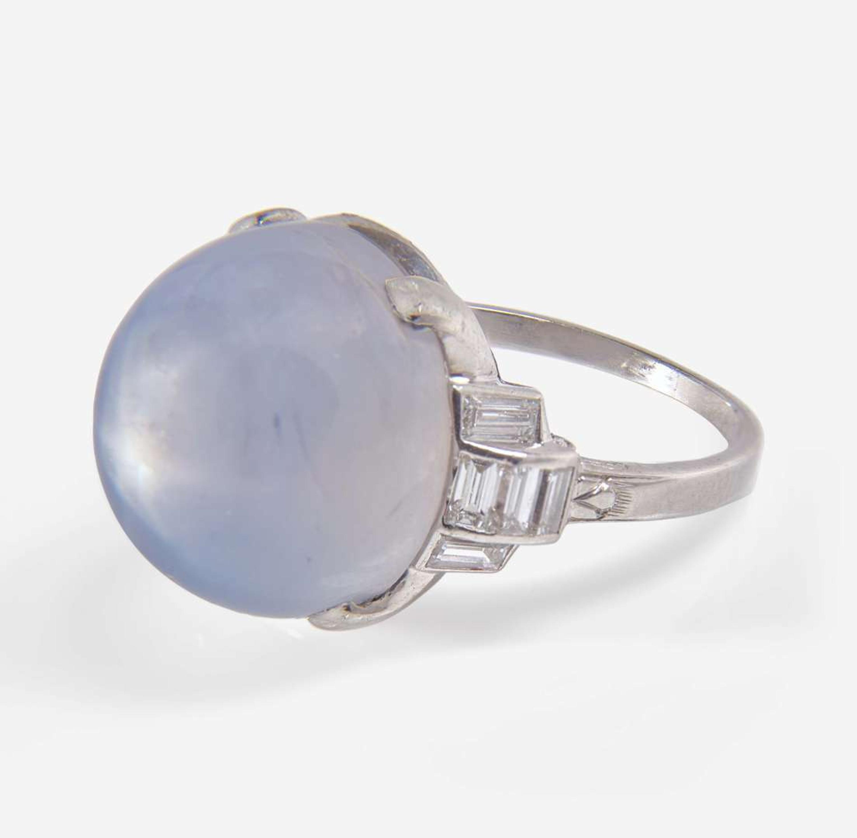 A Platinum, Diamond, and Star Sapphire Ring