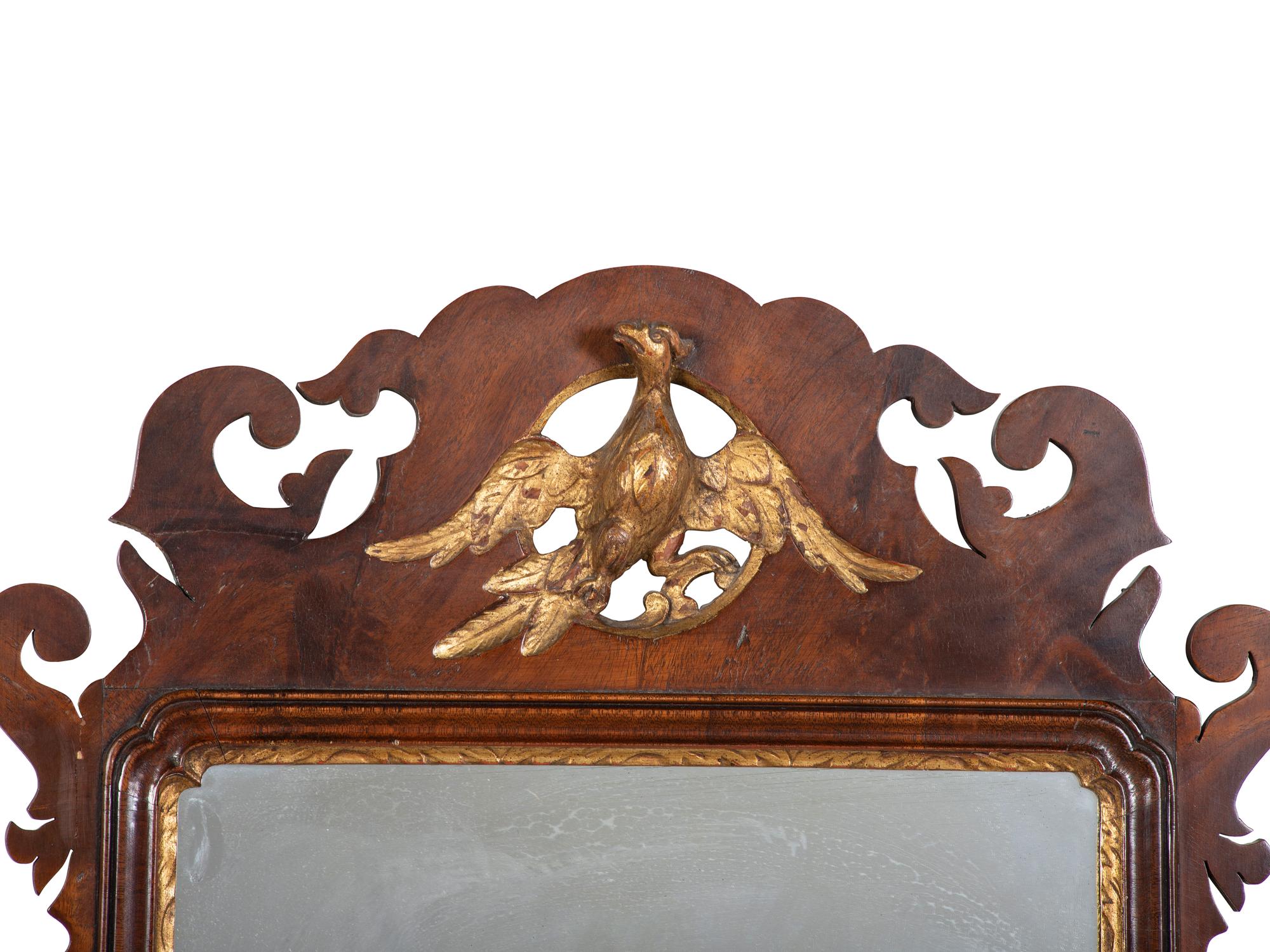A George III Style Parcel Gilt Mahogany Mirror