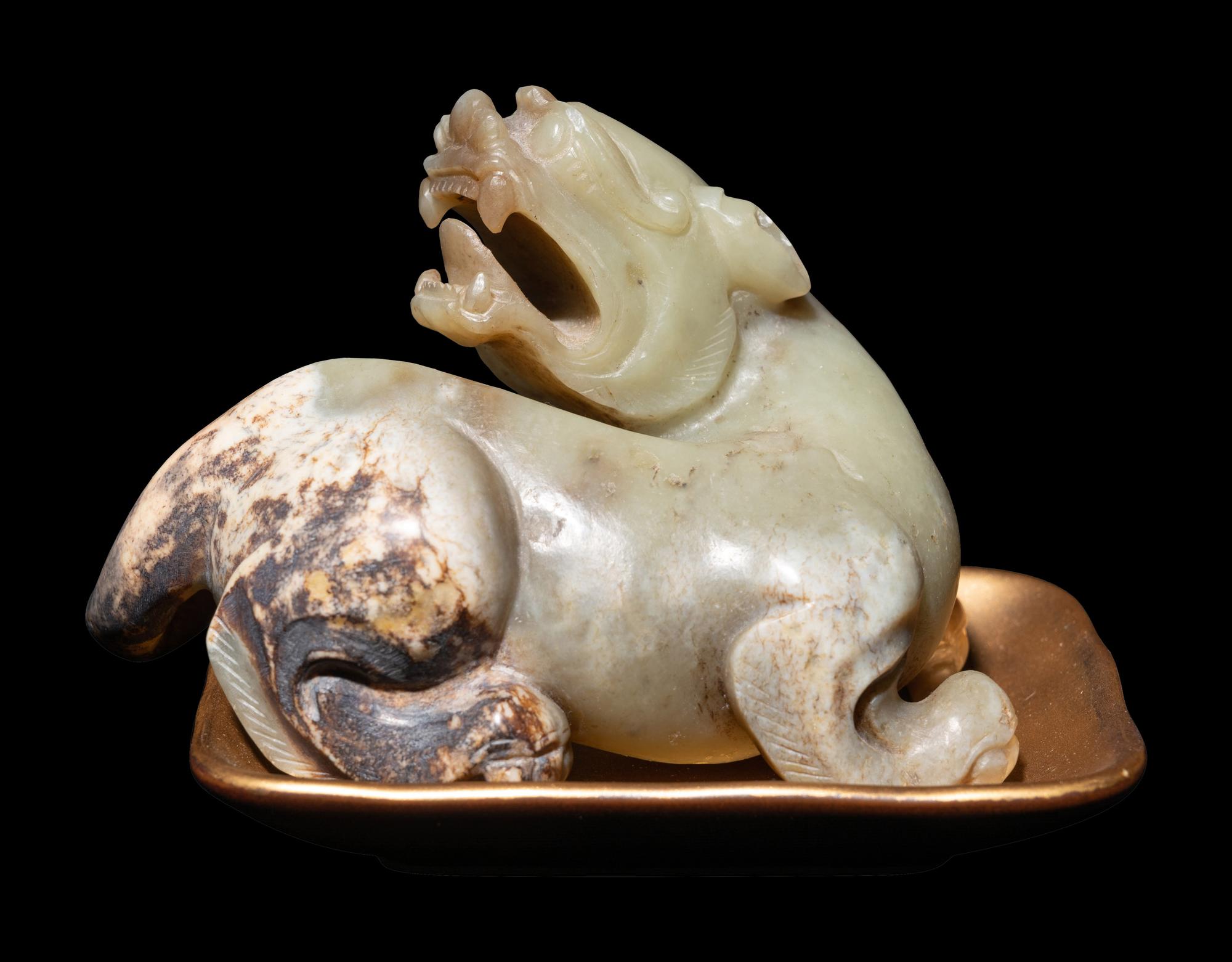A Chinese Celadon Jade Figure of a Recumbent Bixie