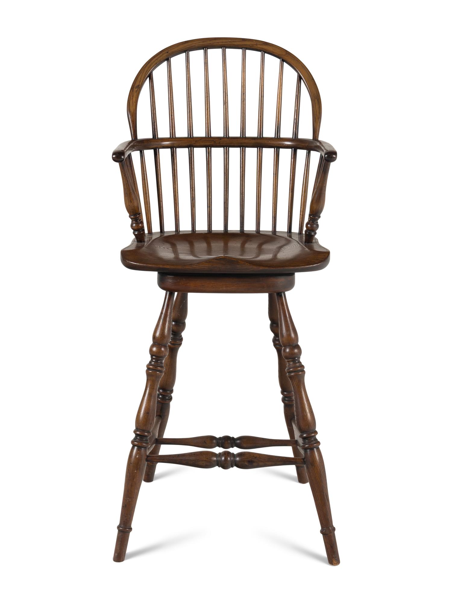 An Assembled Set of Nine Yew, Elm and Beechwood Windsor Armchairs
