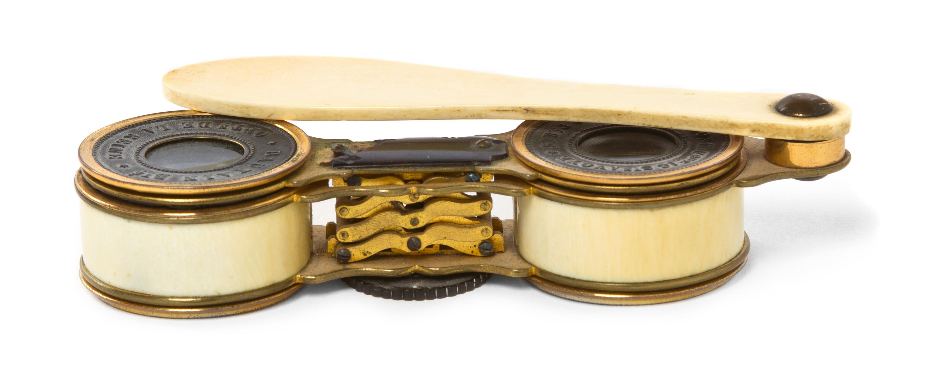 A Pair of French Ivory Mounted Accordion Style Opera Glasses, Bautain, Width 4 inches.