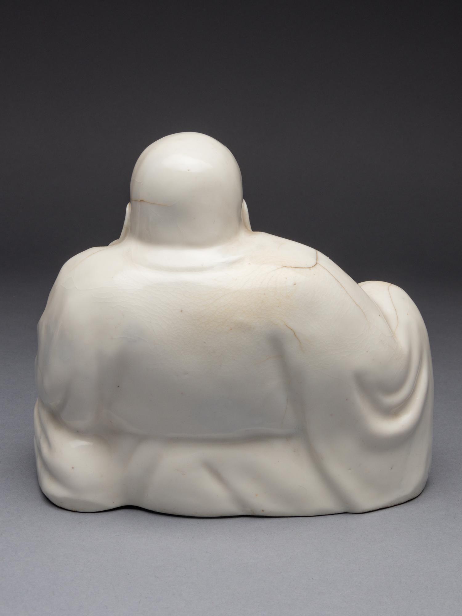 A Blanc-de-Chine Porcelain Figure of Budhai Buddha