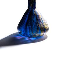 A Roman Marbled Glass Unguentarium