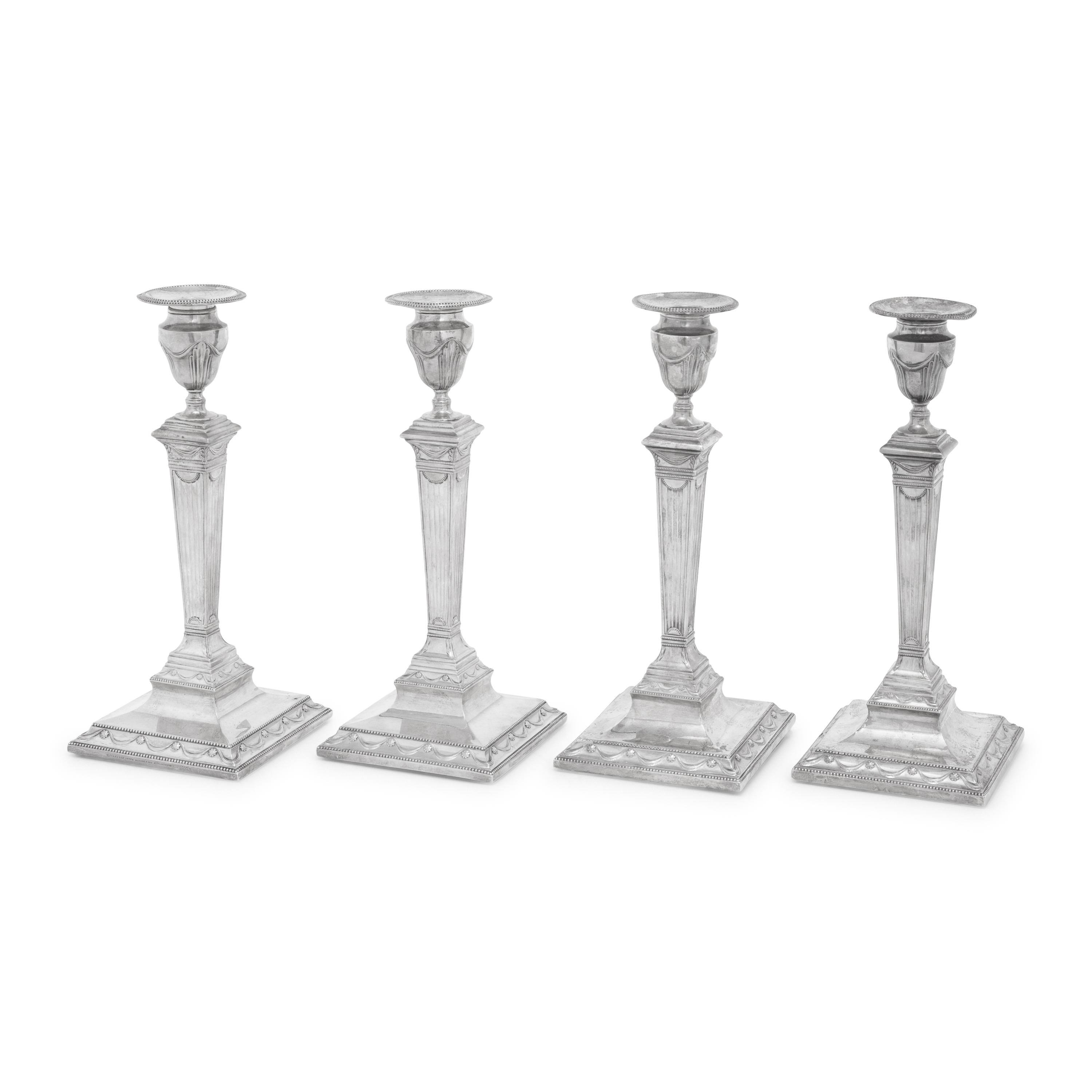 A Set of Four Neoclassical Silver Candlesticks