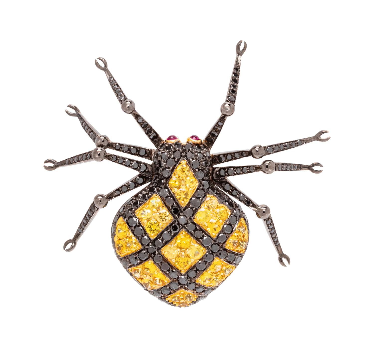 An 18 Karat White Gold, Black Diamond and Yellow Sapphire Spider Brooch,