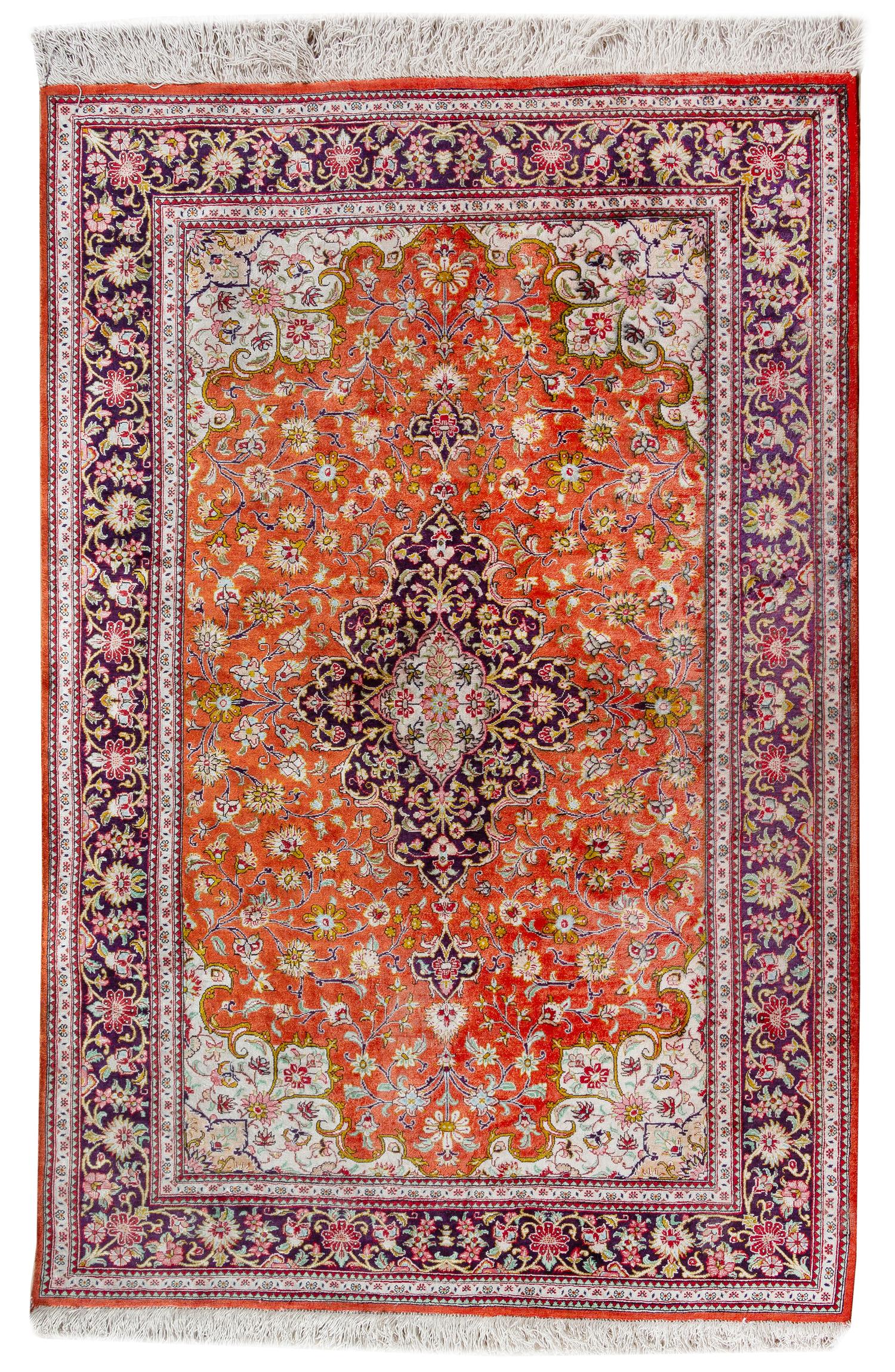A Persian Silk and Wool Rug 4 feet 10 inches x 3 feet 4 inches. — 20TH CENTURY